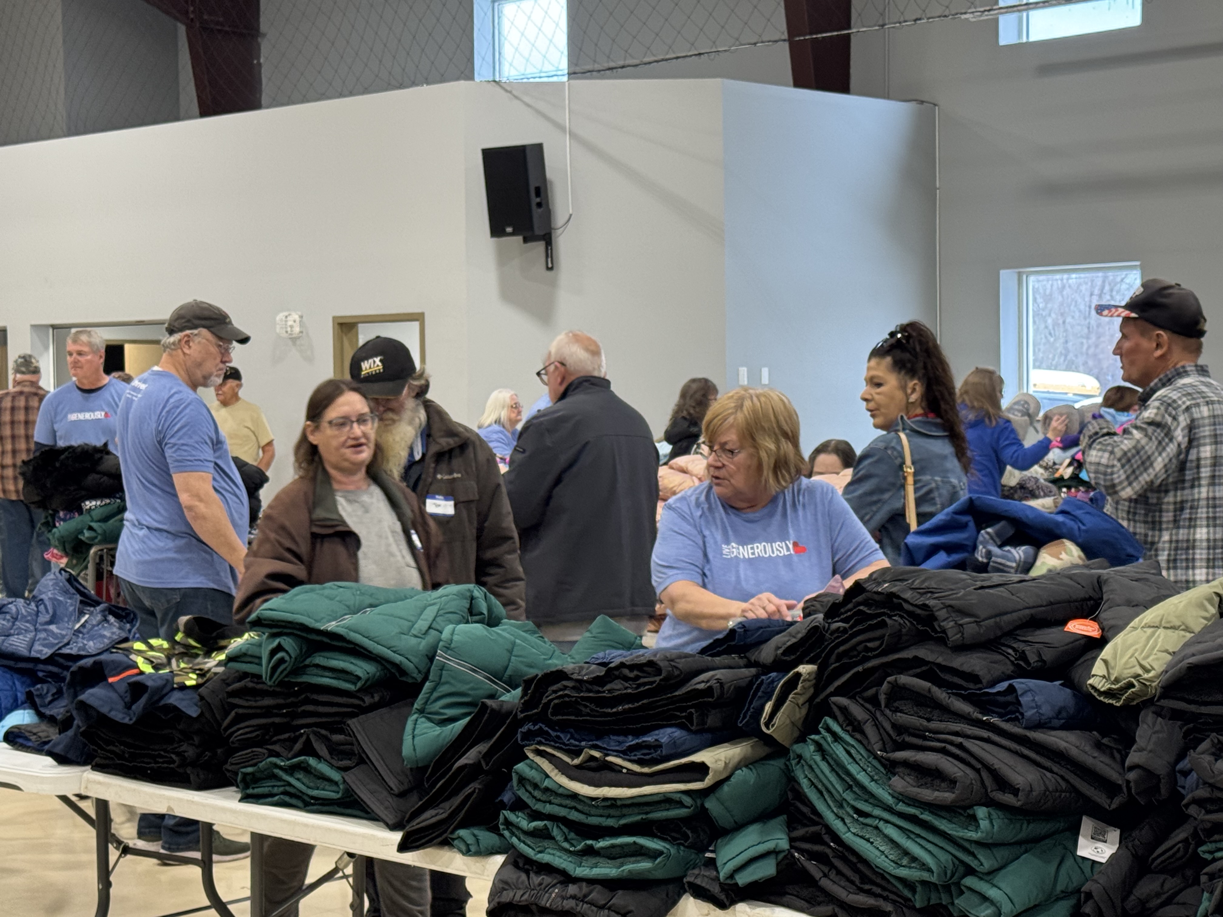 Our dedicated volunteers are joyfully preparing clothes for distribution, ensuring everyone in our community receives warmth and comfort. It's a blessing to serve together!