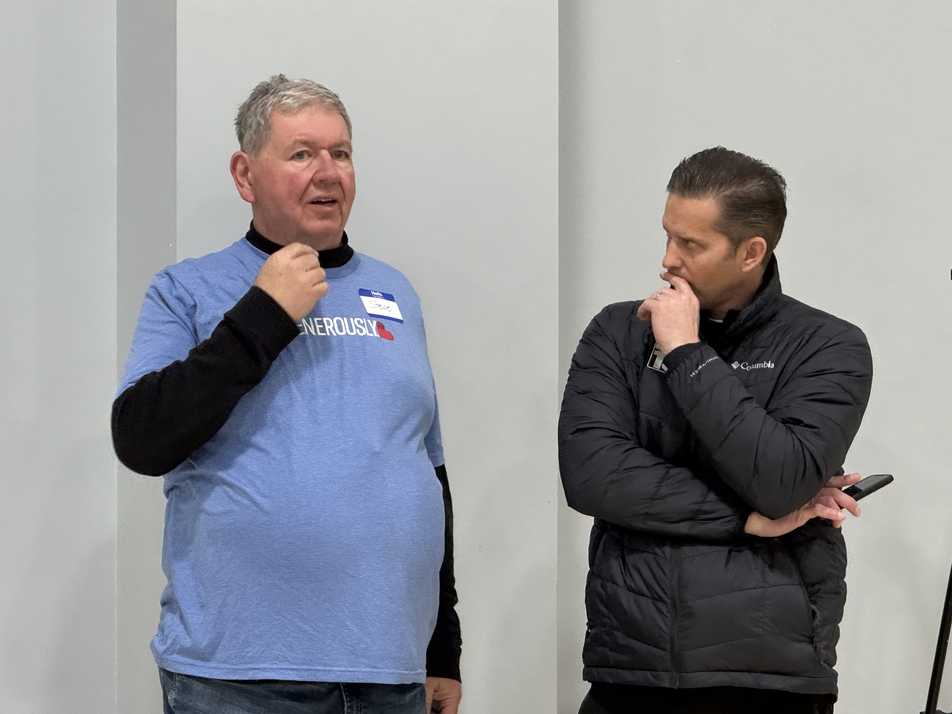 Engaged in conversation, two dedicated individuals connect, sharing thoughts and inspiration. Their discussion fuels the heart of our mission, serving the Lord through generous hearts.