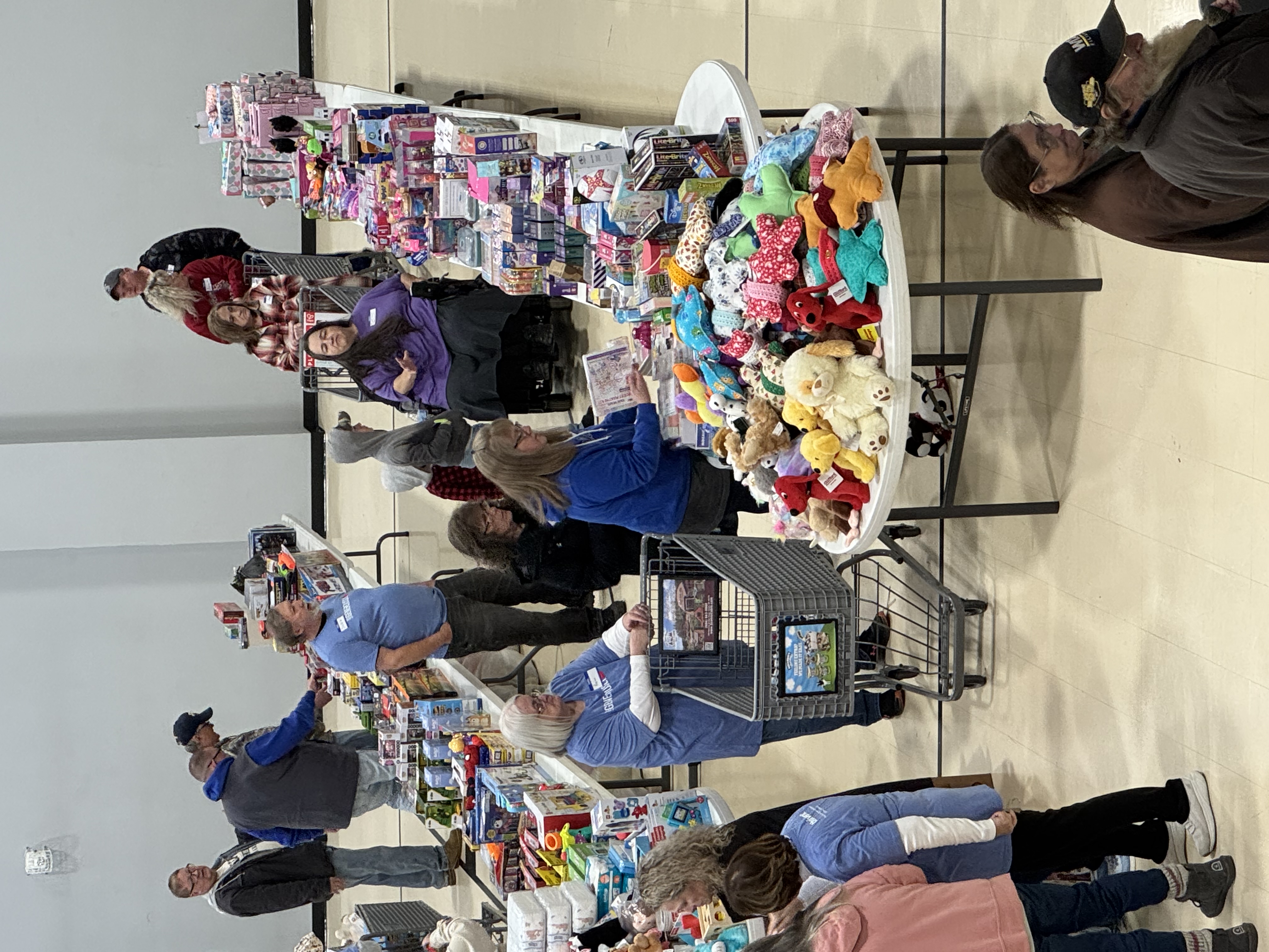 Our dedicated volunteers are busy helping families select gifts, ensuring everyone experiences the joy of giving and receiving.