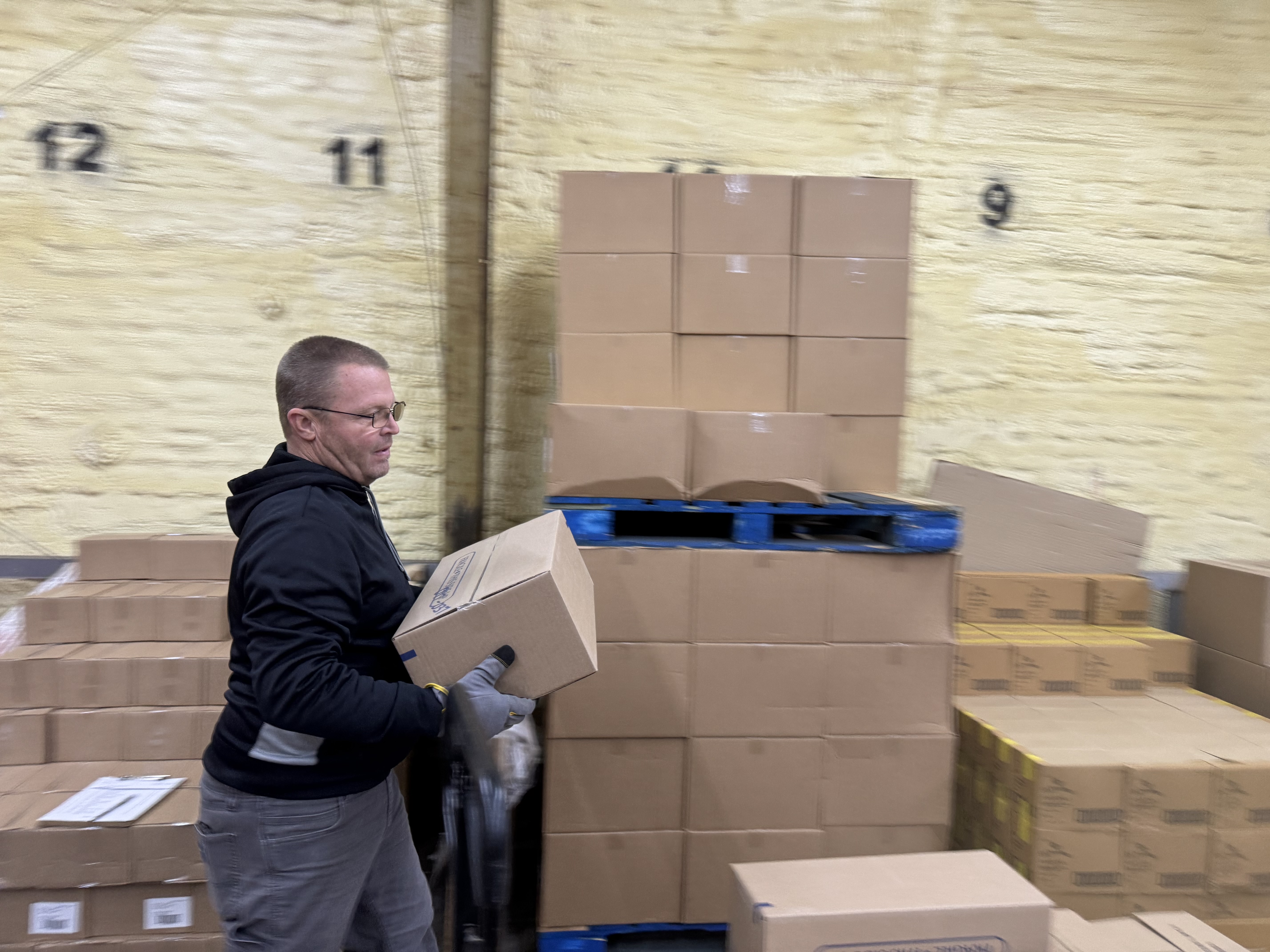 Our dedicated volunteers are hard at work, moving boxes of nourishing food that will soon bless families in our community. Every box represents a meal and a message of hope, packed with love.