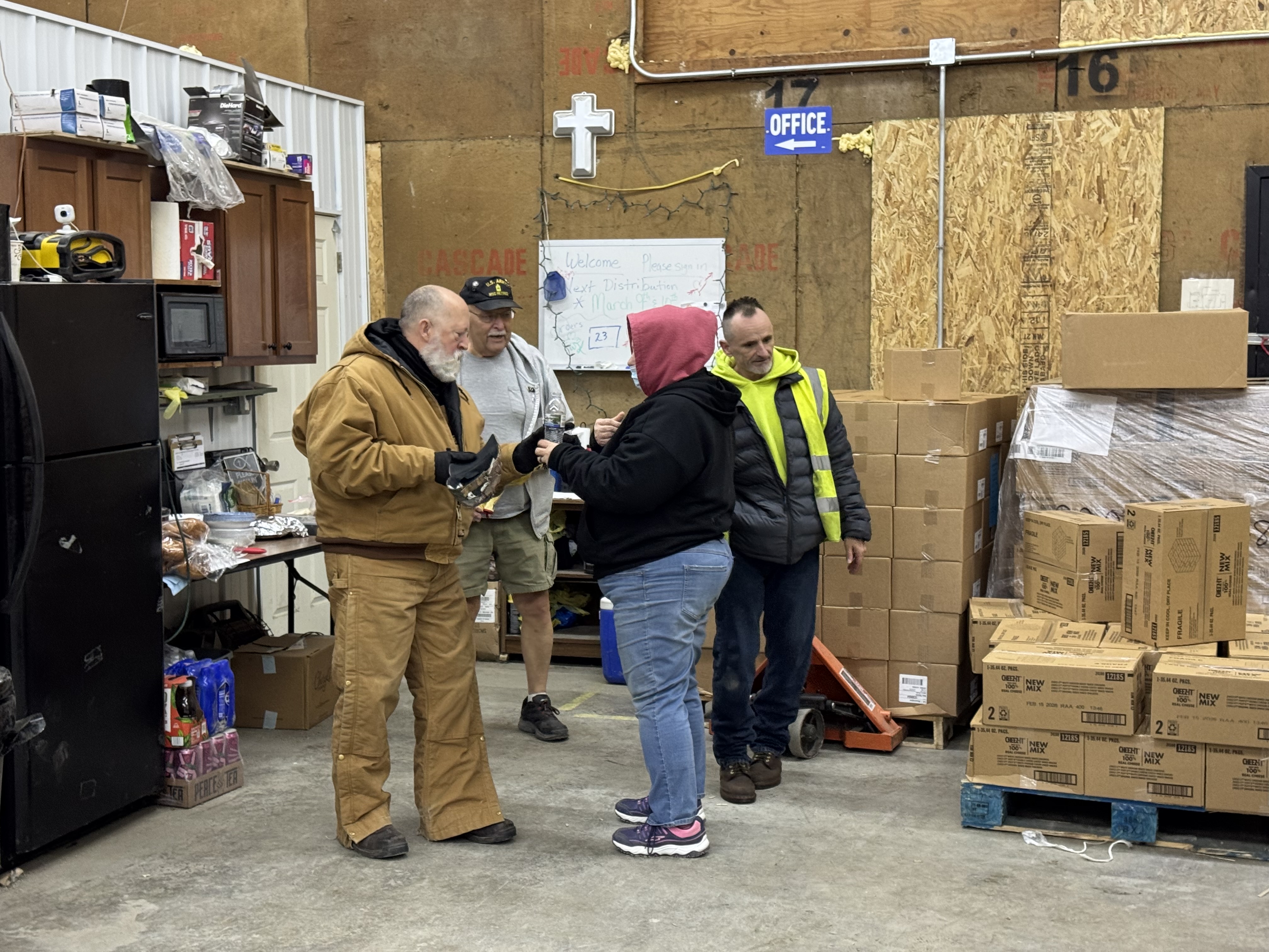 Our dedicated volunteers share a moment of fellowship and connection while preparing for an upcoming food distribution. Their joyful spirit is a blessing to all we serve.
